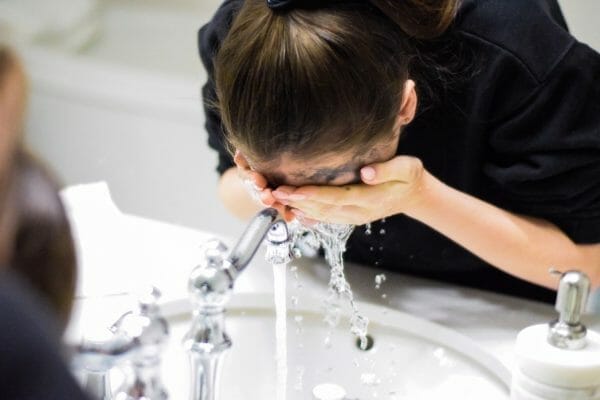 girl washing her face-pip